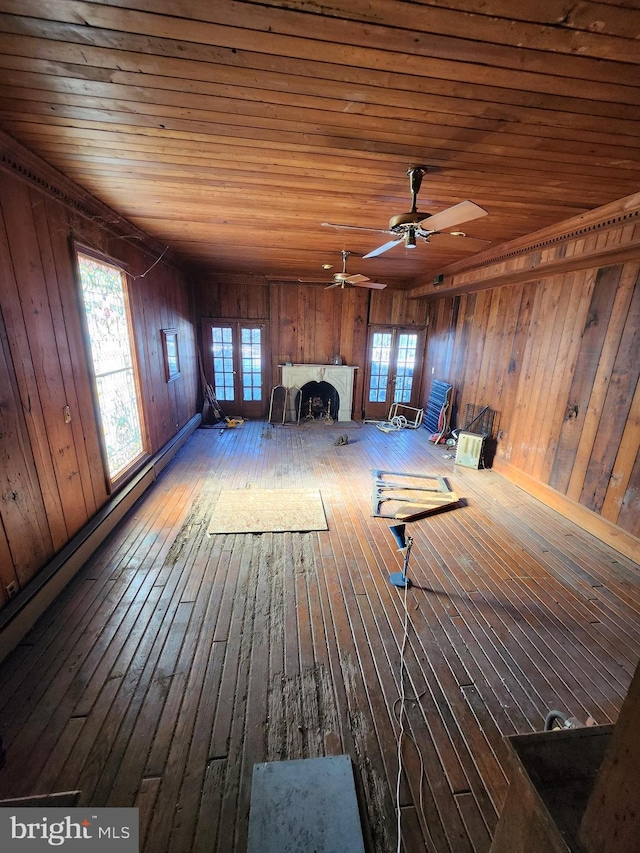 interior space with wooden ceiling, hardwood / wood-style flooring, and ceiling fan