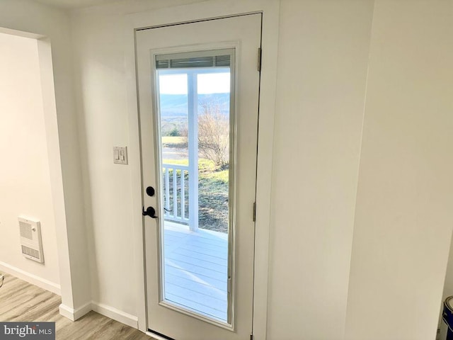 doorway to outside with light hardwood / wood-style flooring