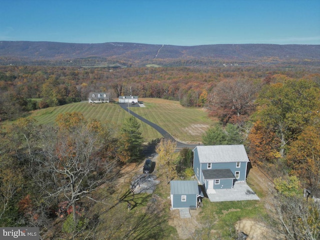 birds eye view of property with a rural view