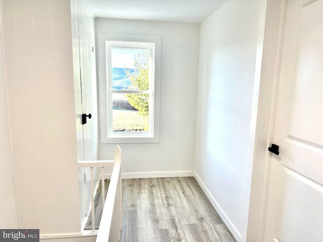 hall with light hardwood / wood-style floors