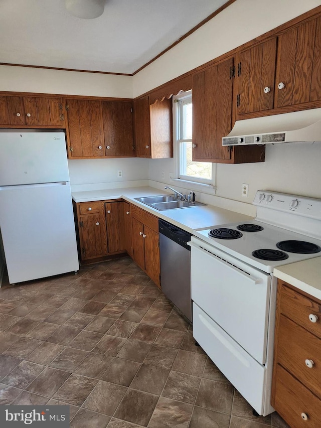 kitchen featuring sink and white appliances