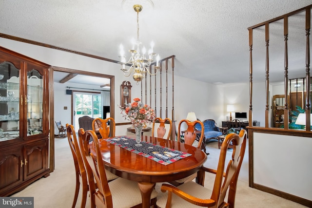 carpeted dining room featuring a textured ceiling, an inviting chandelier, and ornamental molding