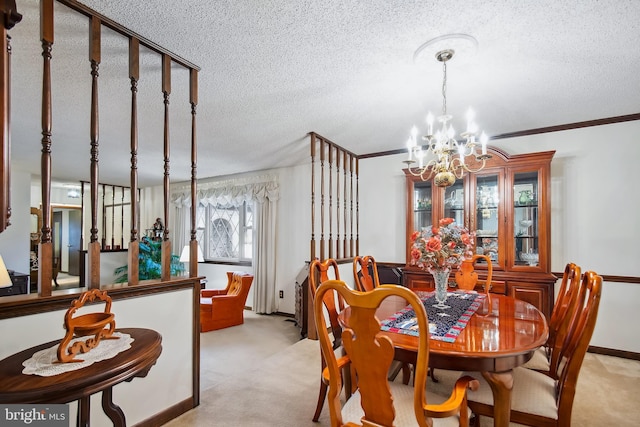 carpeted dining space featuring a textured ceiling, crown molding, and an inviting chandelier