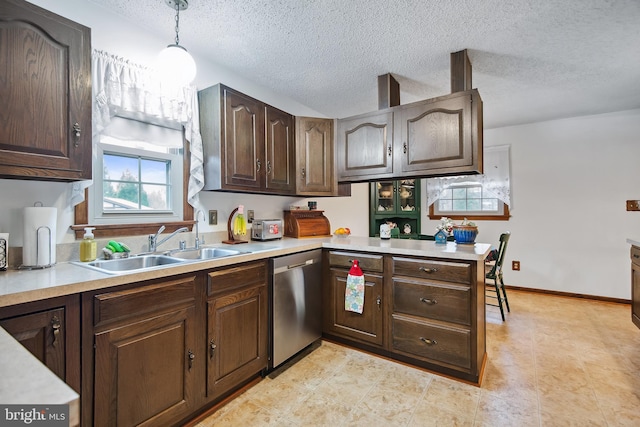 kitchen featuring dishwasher, dark brown cabinetry, decorative light fixtures, and kitchen peninsula