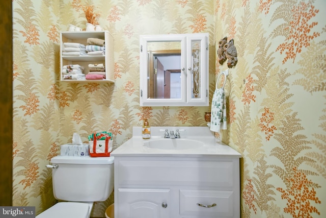 bathroom with vanity and toilet