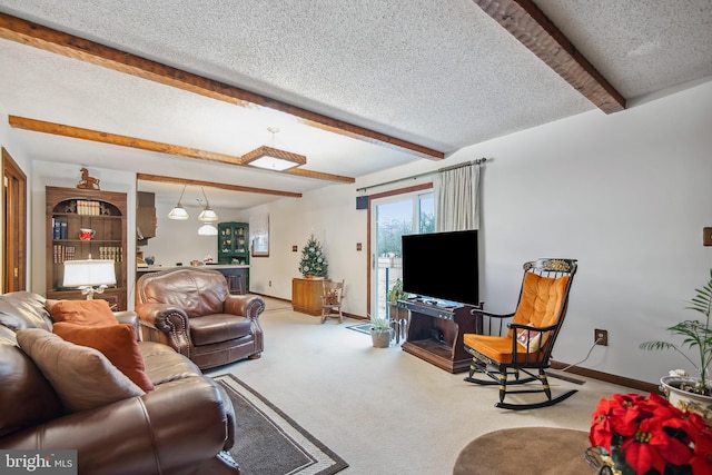 carpeted living room with beamed ceiling and a textured ceiling