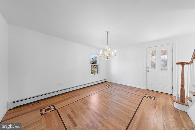 unfurnished dining area featuring hardwood / wood-style floors, a baseboard radiator, and a notable chandelier