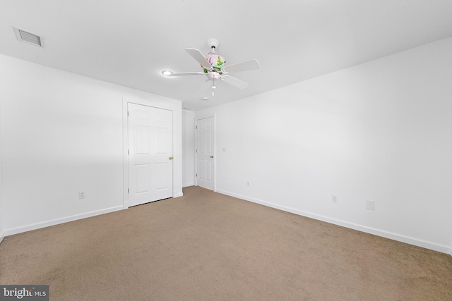 carpeted empty room with ceiling fan