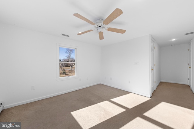 carpeted empty room with ceiling fan