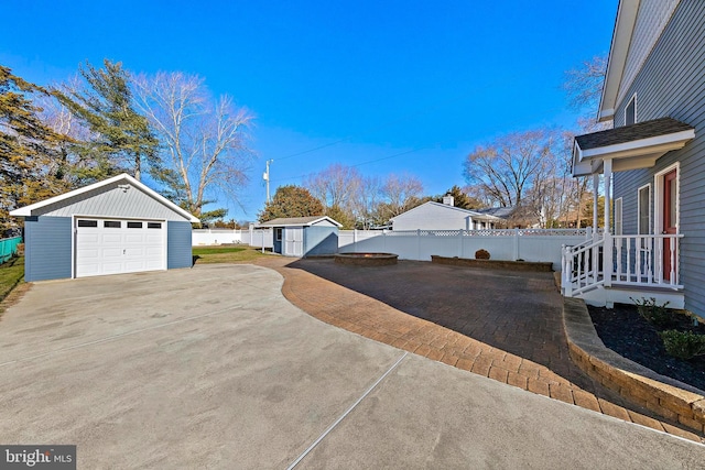 exterior space with an outbuilding and a garage