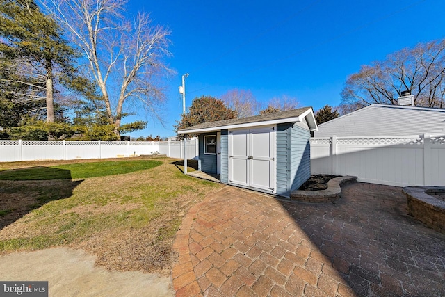 view of yard featuring a patio area and a shed