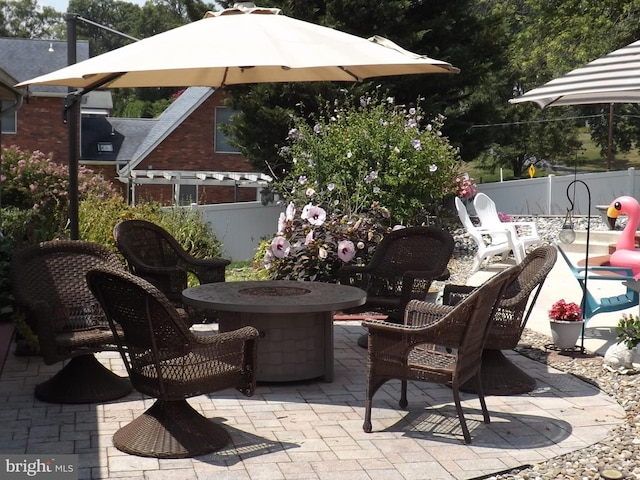 view of patio featuring a fire pit