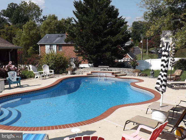 view of pool featuring a patio