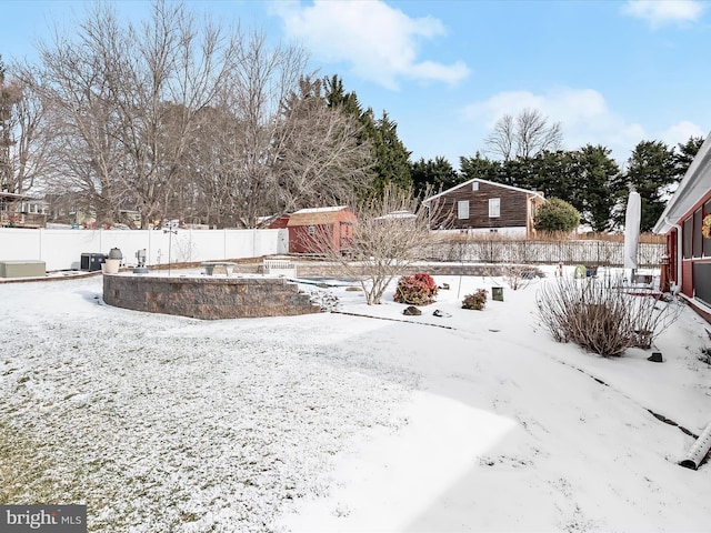 view of yard layered in snow