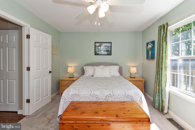 bedroom with ceiling fan and carpet floors