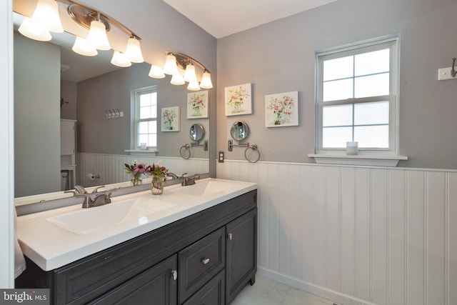 bathroom with vanity and a healthy amount of sunlight