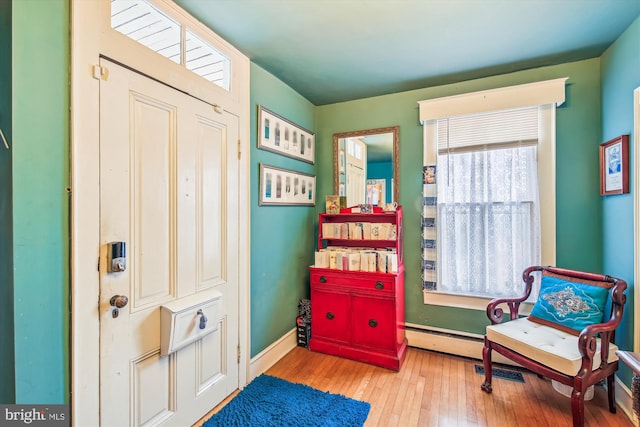 sitting room with hardwood / wood-style floors