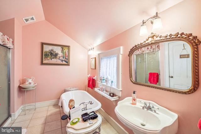 bathroom with tile patterned floors, a shower with door, lofted ceiling, and sink