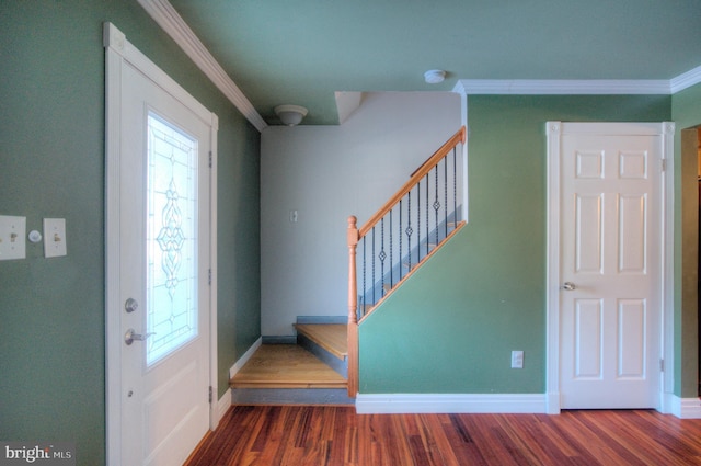 foyer entrance featuring hardwood / wood-style floors and ornamental molding