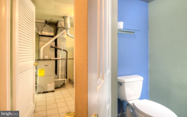 bathroom with tile patterned floors and toilet