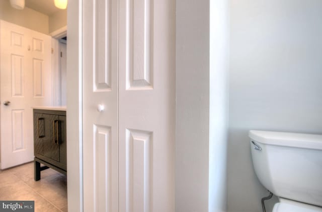 bathroom with tile patterned flooring and toilet