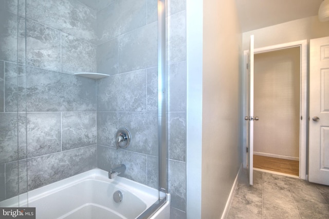 bathroom with washtub / shower combination