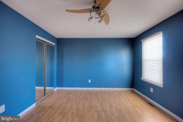 spare room with ceiling fan and hardwood / wood-style floors