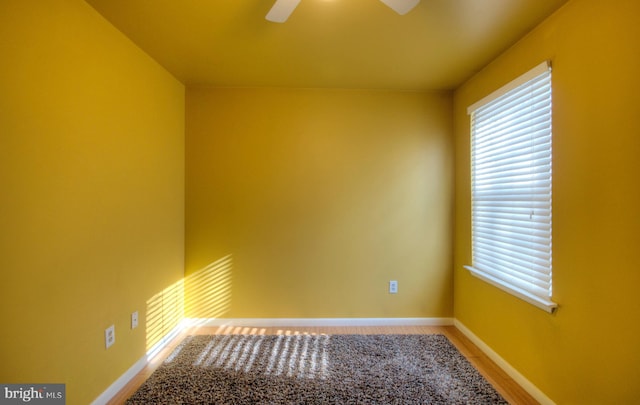 spare room with ceiling fan