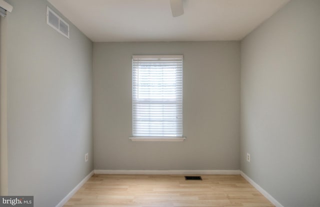 unfurnished room featuring light hardwood / wood-style floors