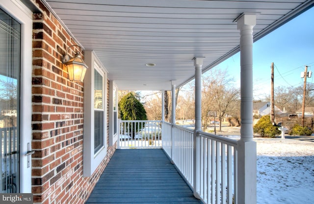 wooden terrace featuring a porch