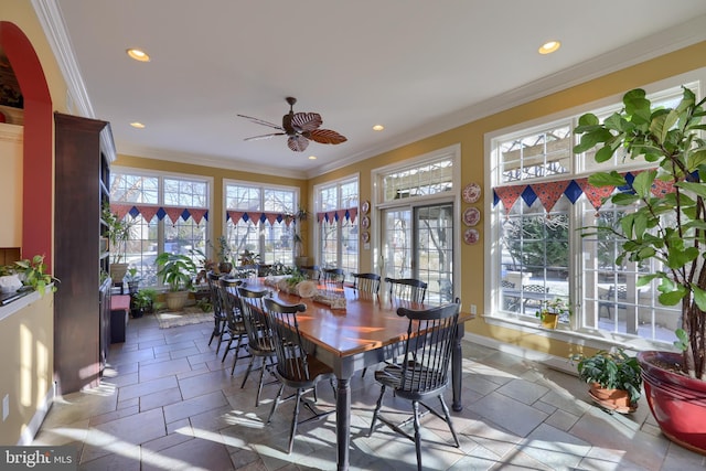 sunroom / solarium featuring ceiling fan