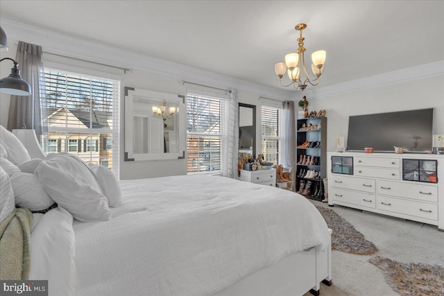 bedroom with a chandelier, carpet floors, and crown molding