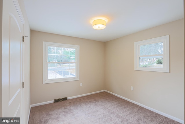 unfurnished room with carpet flooring