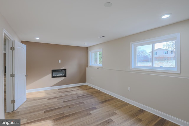 unfurnished room featuring light hardwood / wood-style flooring