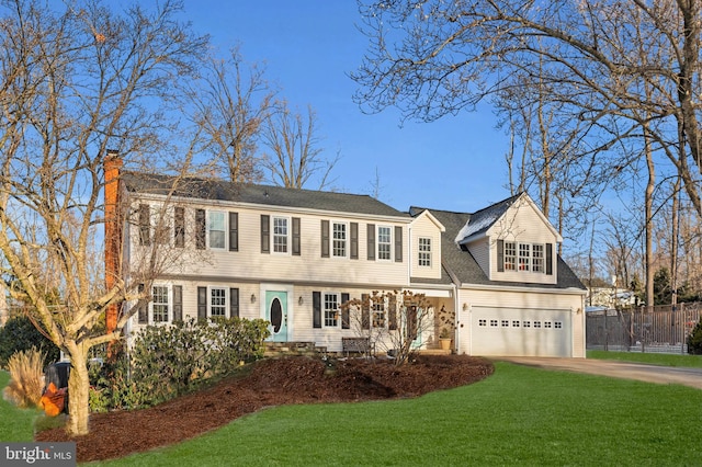 view of front facade featuring a garage and a front lawn