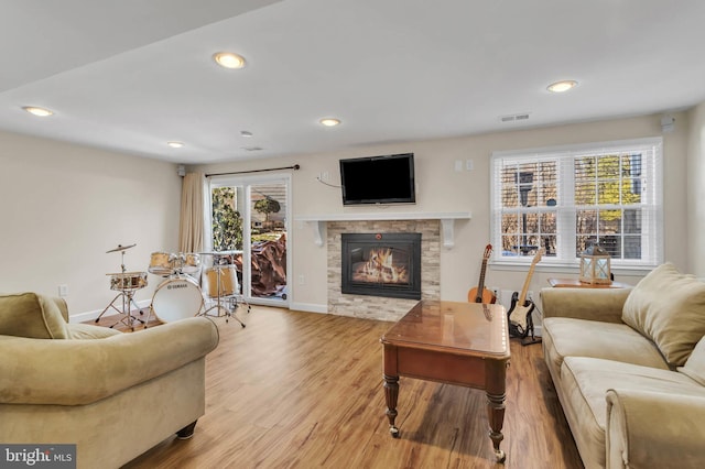 living room featuring hardwood / wood-style flooring and a healthy amount of sunlight