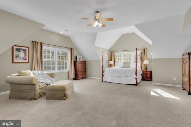 bedroom featuring lofted ceiling, light colored carpet, and ceiling fan