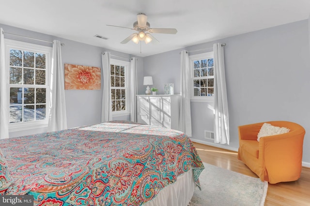 bedroom featuring light wood-type flooring and ceiling fan