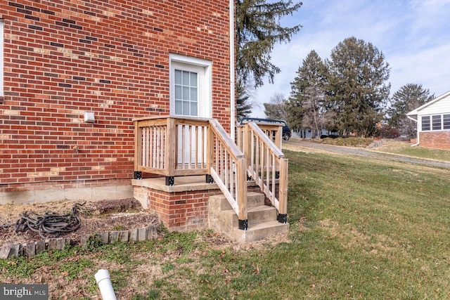 property entrance with a yard