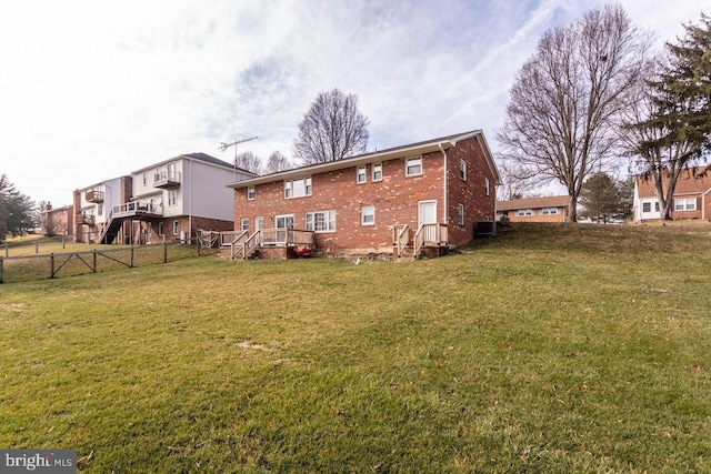 back of property featuring a lawn