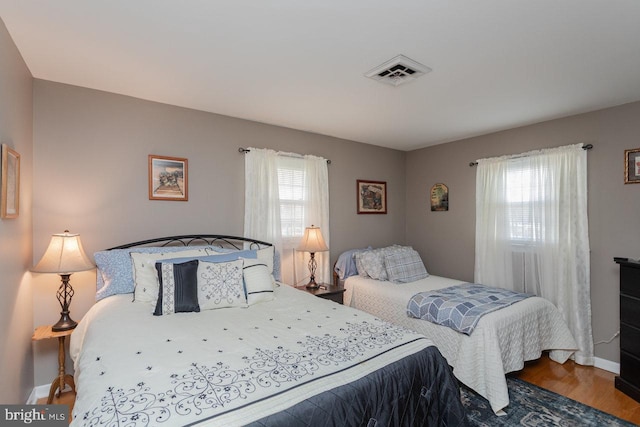 bedroom featuring hardwood / wood-style flooring