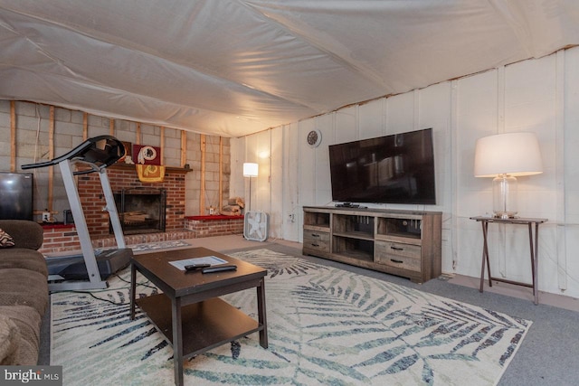 carpeted living room with a fireplace