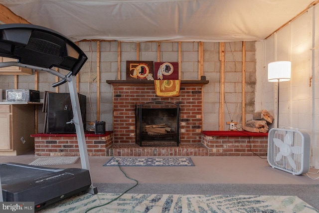 basement with a brick fireplace