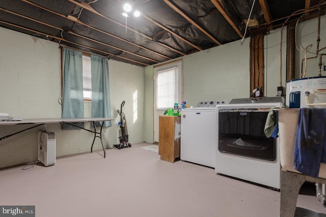 clothes washing area featuring washer and clothes dryer