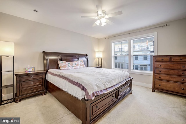 bedroom featuring ceiling fan and light colored carpet