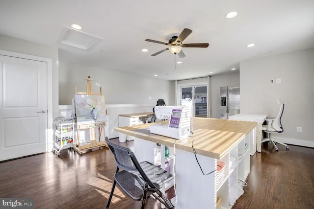 dining area with ceiling fan and dark hardwood / wood-style flooring