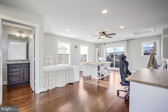 office with ceiling fan, dark hardwood / wood-style flooring, and sink