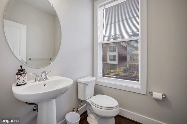 bathroom featuring sink and toilet