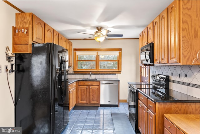 kitchen with ceiling fan, sink, tasteful backsplash, black appliances, and ornamental molding