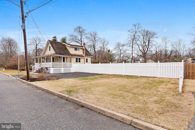 exterior space featuring a yard and a porch